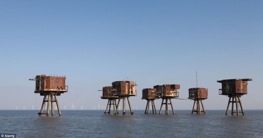 In the Thames estuary the abandoned wartime Redsands forts are rusting away, with Kentish flats windfarm on the horizon