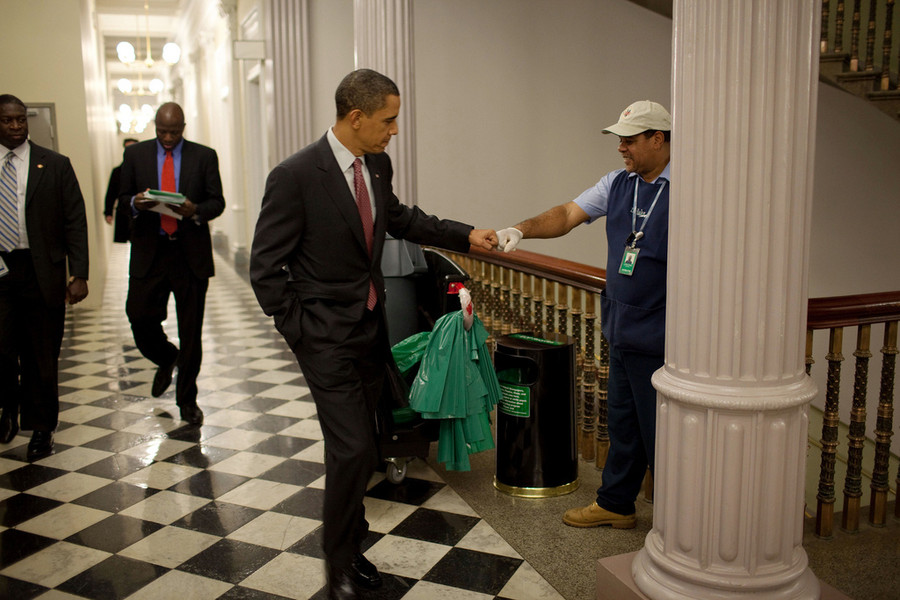 President Barack Obama fist-bumps custodian Lawrence Lipscomb in the Eisenhower Executive Office Building following the opening session of the White House Forum on Jobs and Economic Growth, Dec. 3, 2009. (Official White House Photo by Pete Souza)<br/><br/>This