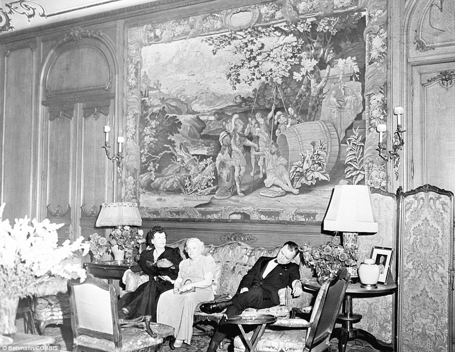 Comfy: One of the dancers who attended the Benefit for the United Service Organization at the Vanderbilt Mansion is caught falling asleep beneath one of the priceless tapestries of the famous society clan