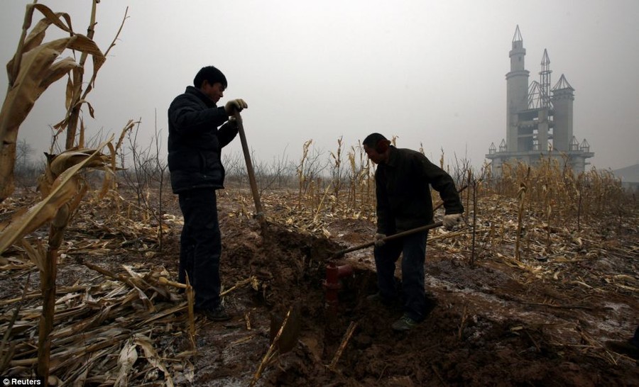 Farmers dig a water well in a field that should have been landscaped gardens for the enchanted castle