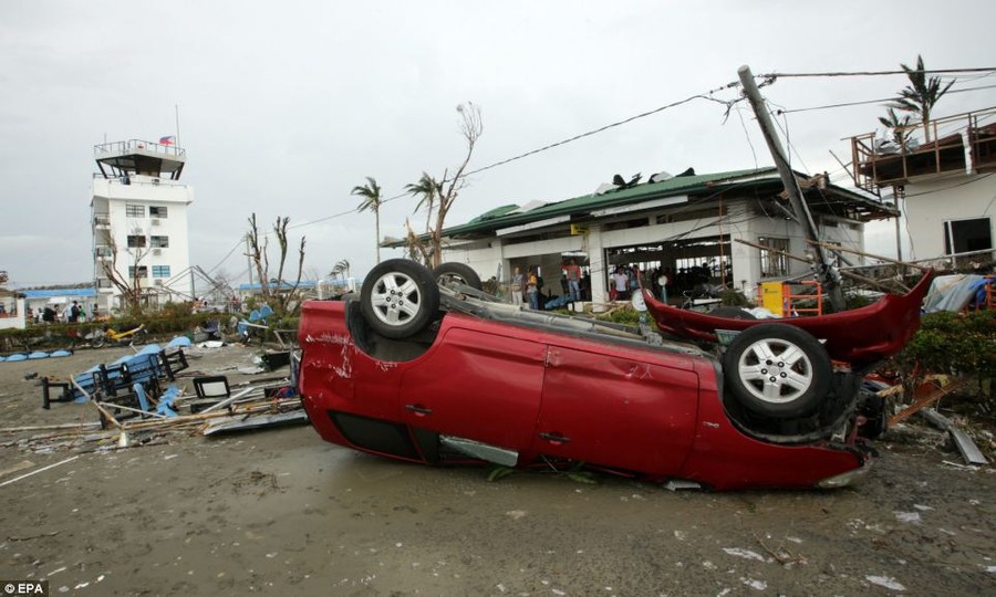 Upside down: A devastated airport in Tacloban city, Leyte province - where roofs were ripped on hundreds of houses