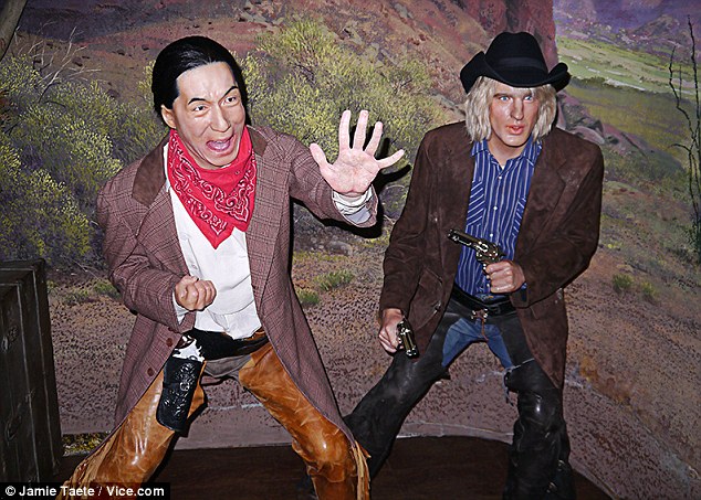 Cowboys: Jackie Chan and Owen Wilson look as surprised by their appearance as visitors to the museum are