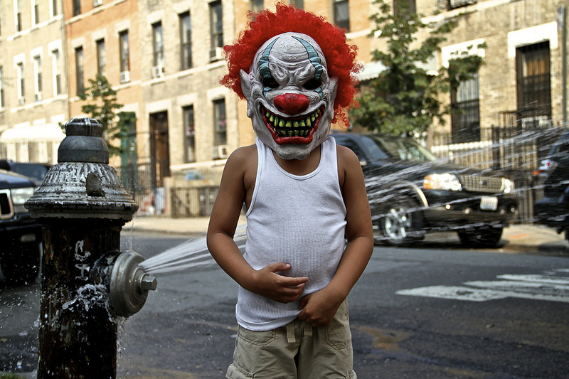 clown + open fire hydrant = summer in the city