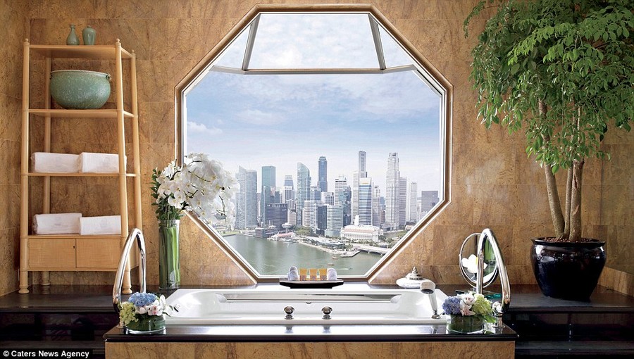Guests bathing in the Ritz-Carlton Suite at the Ritz-Carlton Singapore can enjoy views of the Singapore skyline and Marina Bay