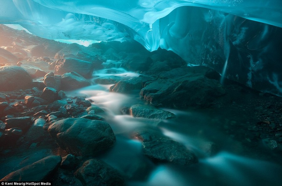 Lightshow: The creative talent behind the set of photos has managed to capture the beautiful images by lining up the rising sun with the inside of a glacial tunnel