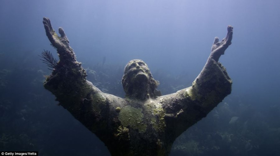 Christ of the Abyss is now covered in barnacles and coral but it was deliberately put there in 1954 as a tribute to a pioneer of scuba diving who died