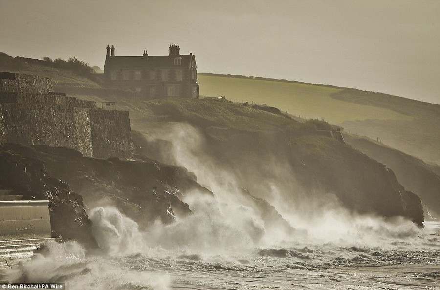 Rough seas at Porthleven, in Cornwall, batter the coastline ahead of the worst storm in decades which was set to hit the UK