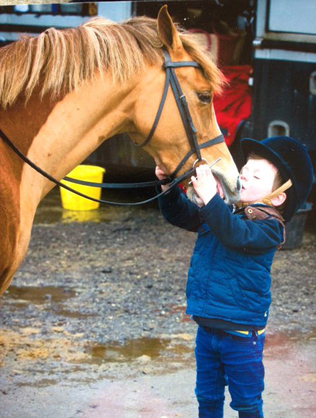 Love of horses: The toddler is hoping to become one of the youngest ever winners when he makes his national debut at Birmingham NEC
