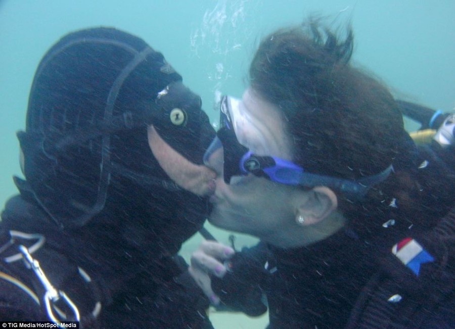 Support: Sean gets a kiss from his fiance Mikaela Papagiorcopulo during his record breaking dive