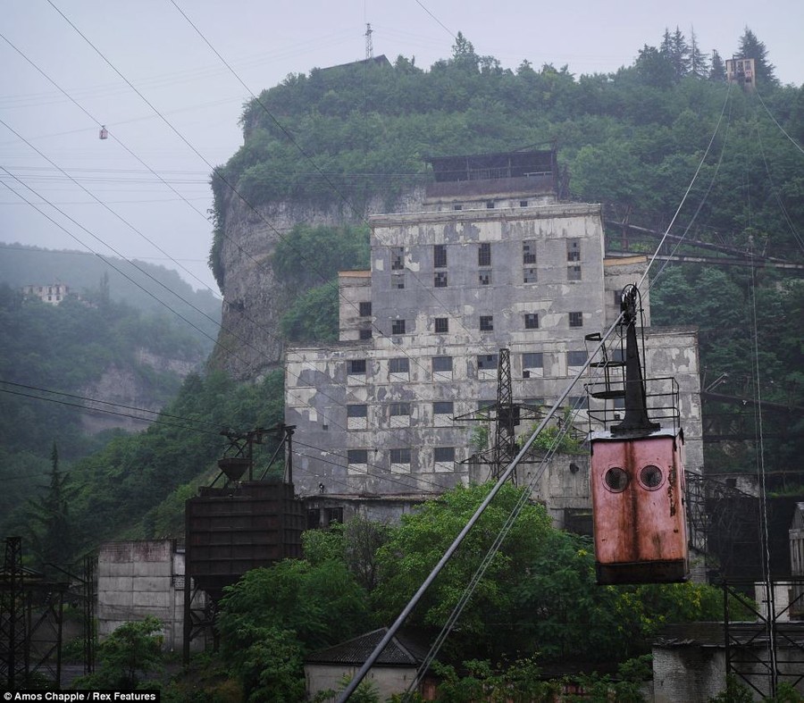 Commute: Soviet era miners' took the aerial tramway to work at the manganese processing plants dotted across the hills surrounding Chiatura