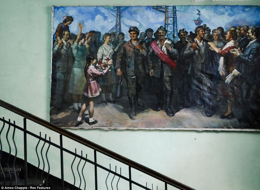 Art: A Socialist realist painting hanging on the inside of a building in Chiatura celebrates the manganese miners of the town 